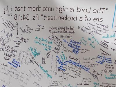 A close-up of a portion of the banner of condolences from Bob Jones University to CIU. 